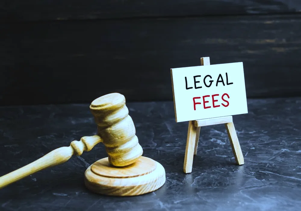 Legal Fees written on a Board with Judge's hammer