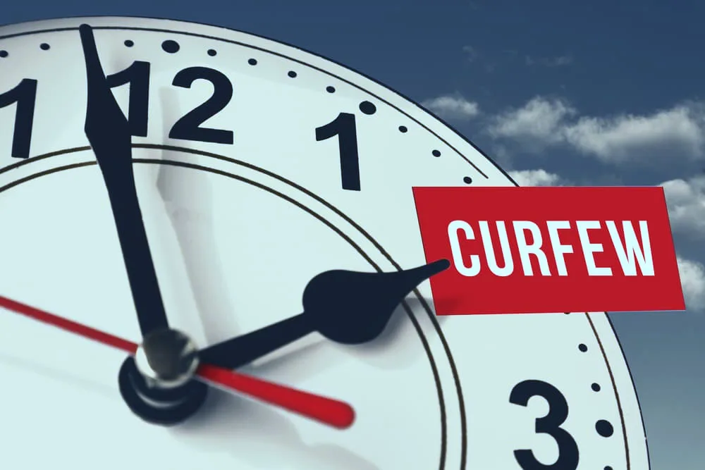 The hand of the clock indicates curfew timing.